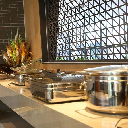 Qiu Guo Hotel Hua Mao Chaoyang  Bagian luar foto
